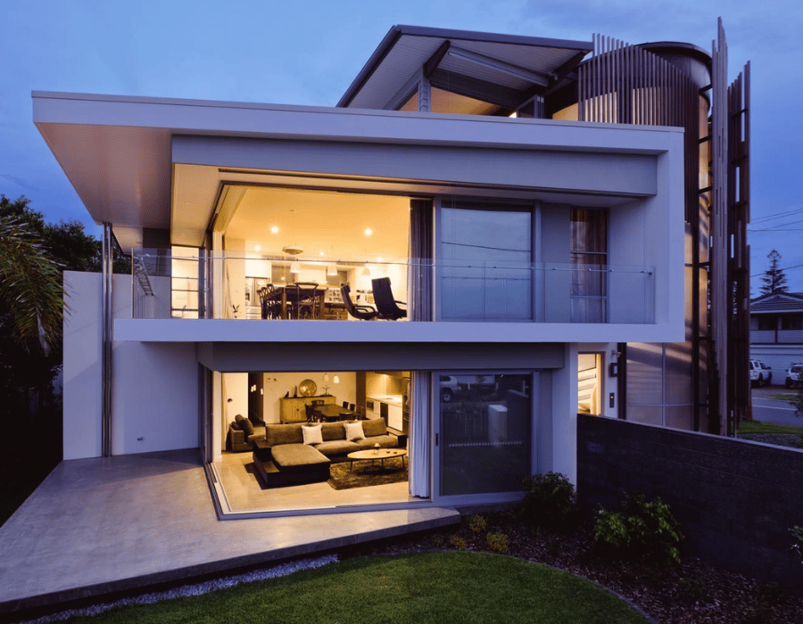 CREATE Architecture team discussing custom floor plans with clients for a new home in the Northern Rivers.