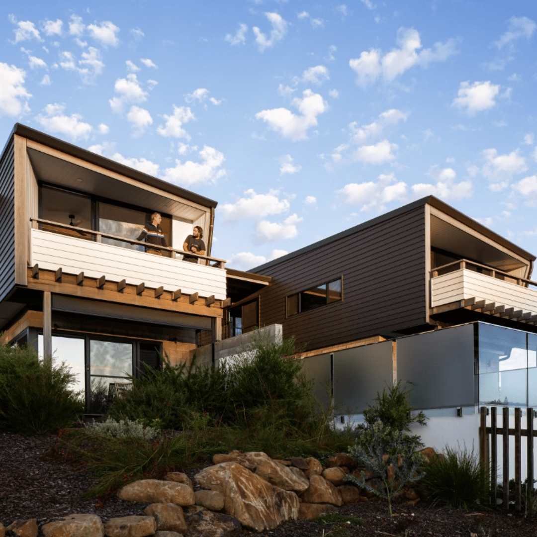 Lennox Head coastal renovation with a new deck, timber battens, and open-plan living space by CREATE Architecture.