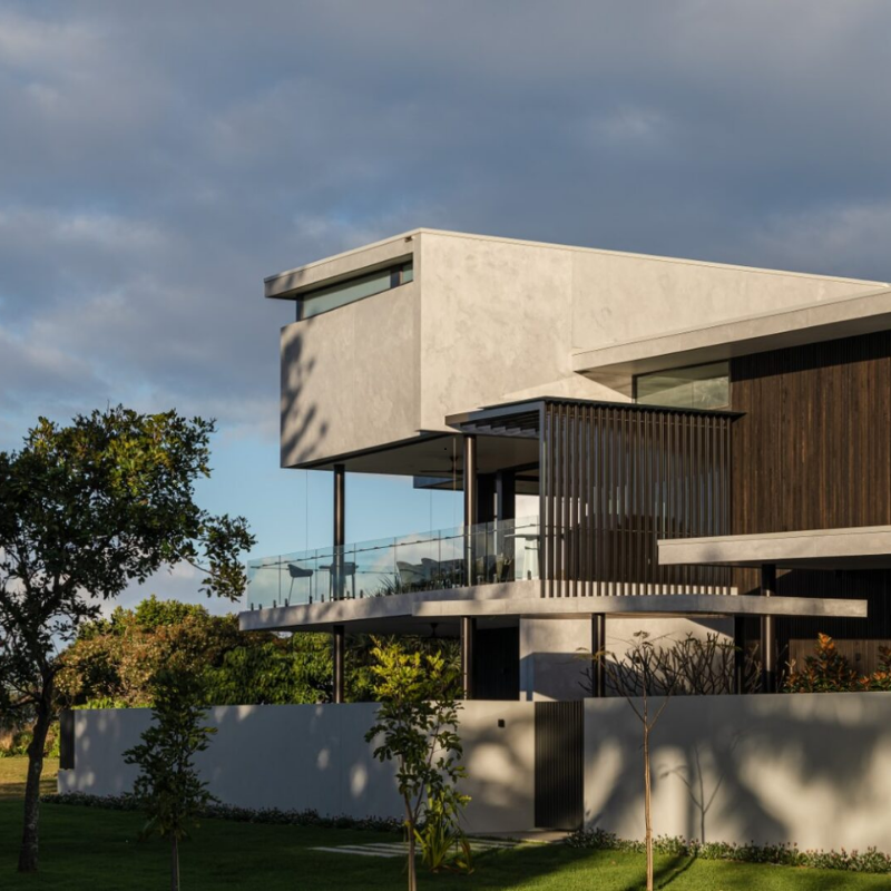 Coastal home exterior designed by a residential architect in Kingscliff, featuring modern lines, durable materials and shaded outdoor living.